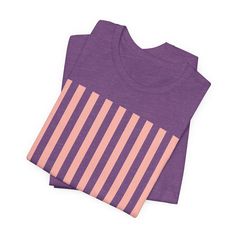 Introducing our Coral Pink Stripes Shirt, a feminine and chic addition to your wardrobe. Made with pretty pink and white vertical stripes, this classic t-shirt brings a cute and stylish touch to any casual outfit. This classic unisex jersey short sleeve tee fits like a well-loved favorite. These soft cotton t-shirts have-ribbed knit collars to bolster shaping. The shoulders are tapered for a better fit over time. Dual side seams hold the garment's shape for longer. .: Made with 100% Airlume comb Spring Crew Neck T-shirt With Striped Collar, Spring Cotton T-shirt With Striped Sleeves, Casual Crew Neck T-shirt With Striped Sleeves, Casual Striped Sleeve Crew Neck T-shirt, Trendy Short Sleeve Tops With Vertical Stripes, Trendy Striped Crew Neck Shirt, Casual Cotton T-shirt With Striped Sleeves, Pink Short Sleeve Top With Striped Collar, Spring Cotton T-shirt With Striped Hem