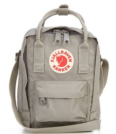 From Fjallraven&#x2C; the Kanken sling crossbody bag features: Vinylon F: 100% vinylalVersatile shoulder bag made in hardwearing Vinylon F fabricFront pocket&#x2C; main compartment and zippedrear compartmentName and address label inside main compartmentWear as crossbody sling or hold with double handlesApprox. 20 cm H x 15 cm W x 11 cm DApprox. 2.5 L capacityApprox. 6.75 ounces weight Imported. Fjallraven Kanken Sling, Kanken Sling Bag, Fjallraven Mini, Kanken Sling, Pretty Tote Bags, Sling Crossbody Bag, Mini Crossbody Purse, Brown Leather Crossbody Bag, Canvas Messenger Bag