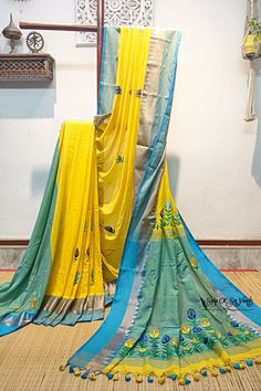 Elevate your ethnic wardrobe with our stunning handloom pure cotton saree in vibrant yellow, adorned with a magnificent firoza-colored temple woven border. This saree is a masterpiece of craftsmanship, featuring intricately embroidered multicolor floral design, neatly and artistically crafted onto the fabric. In addition to its exquisite design, this saree is designed for comfort and style. Crafted from pure, soft cotton, it offers a luxurious and comfortable drape, making it a joy to wear on any occasion. To complete the ensemble, a matching blouse piece with delicate embroidery work is included. Discover the perfect blend of tradition, artistry, and comfort with this exceptional pure cotton saree. Elevate your fashion quotient while celebrating the rich heritage of Indian textiles. Shop Yellow Chanderi Dupatta With Embroidered Border, Festive Cotton Saree With Embroidered Border, Yellow Cotton Handloom Dupatta, Yellow Cotton Saree With Zari Weaving, Yellow Cotton Dupatta With Zari Work, Yellow Cotton Traditional Wear With Resham Embroidery, Yellow Semi-stitched Cotton Traditional Wear, Yellow Embroidered Cotton Dupatta, Yellow Cotton Traditional Wear With Zari Weaving