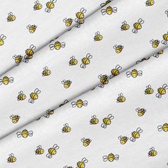 a white background with yellow and black bees on it