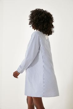 The traditional shirt dress reinvented, Lottie combines classic features with modern updates. A wardrobe hero thanks to its always on-trend blue and white stripes and contrast placket, this mini is the definition of desk to drinks styling. Add sandals for a day on the water or loafers for the office, this classic-with-a-twist silhouette does it all! Band collar Long sleeves Button cuffs Half length front placket Contrast bib Relaxed fit Mini length Material: 50% Polyester, 50% Cotton, Trim: 100% Chic Shirt Dress With Striped Collar For Daywear, Spring Striped Shirt Dress For Work, Spring Shirt Dress With Striped Collar For Work, White Long Sleeve Dress With Striped Collar, Spring Workwear Shirt Dress With Striped Collar, Spring Shirt Dress With Striped Collar For Daywear, Spring Daywear Shirt Dress With Striped Collar, Striped Collar Shirt Dress, Daywear Shirt Dress With Striped Collar