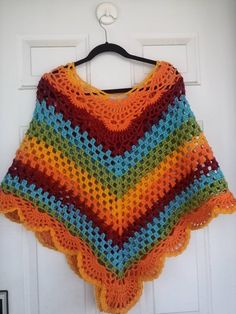 "This beautiful poncho is handmade from 100 percent acrylic yarn. It is a great addition to any woman wardrobe. The neck circumference is 35\"/89cm and lent from V down is 24\"/61cm long. The colors are beautiful and vibrant. Care: wash and dry on low temperature." Crochet Loom, Woman Wardrobe, Crochet Hobby, Poncho Au Crochet, Ladies Poncho, Crochet Poncho, Women's Wardrobe, 100 Percent, Acrylic Yarn