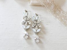 Silver Bridal earrings Swarovski white opal Wedding earrings | Etsy Glamorous White Chandelier Earrings With Sparkling Stones, White Crystal Bridal Earrings With Sparkling Stones, White Crystal Chandelier Earrings For Formal Occasions, Formal White Crystal Chandelier Earrings, Formal White Chandelier Earrings With Sparkling Stones, Elegant White Chandelier Earrings With Sparkling Stones, White Crystal Wedding Earrings With Sparkling Stones, White Crystal Earrings With Sparkling Stones For Wedding, White Chandelier Earrings For Wedding With Sparkling Stones