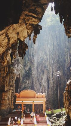 the inside of a cave with steps leading up to it