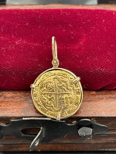 Atocha shipwreck treasure Mel fisher silver gold coin pendant handmade with 14kt solid gold This is made from mould of the actual atocha gold coins. Please note that the actual atocha gold coin run from 20k to 40k even more. This is a museum quality recreation of actual atocha gold coin. Ancient Yellow Gold Coin Pendant Jewelry, Byzantine Yellow Gold Coin-shaped Jewelry, Byzantine Style Coin-shaped Yellow Gold Jewelry, Byzantine Style Coin Shaped Yellow Gold Jewelry, Ancient Gold Coin Necklace, 14k Gold Coin Amulet, Yellow Gold Coin-shaped Charms Jewelry, Byzantine Style Yellow Gold Coin Jewelry, Yellow Gold Coin-shaped Jewelry With Charms