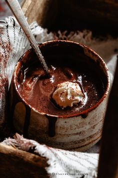 a chocolate dessert in a bucket with a spoon