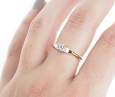 Vintage 1940's 14k yellow gold Art Deco diamond engagement ring. The European cut diamond weighs approximately .08ct. The diamond is J color, and VS2 clarity. The size of the ring is a 7, and has the ability to be resized. The height of the ring off of the finger is 4.6mm. The width of the band is 2.5mm, and tapers up to 1.6mm. Unique vintage ring boxes available - in separate listing, there are two beautiful options. Please check out both and select one (link below). Limited supply- don't miss Classic Gold Wedding Ring With Single Diamond, Gold Asscher Cut Single Diamond Wedding Ring, Asscher Cut Single Diamond Gold Ring For Wedding, Vintage Yellow Gold Diamond Promise Ring, Gold Art Deco Diamond Ring With Single Diamond, 1940s Engagement Ring Eragem, Art Deco Diamond Ring Engagement, Vintage Ring Box, Unique Rings Vintage