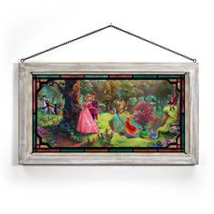 a painting hanging on the wall with a chain attached to it's frame, featuring an image of princess and prince