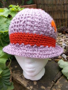 Woman's Cloche Hat, Hand crocheted and felted in a Unique Design to fit sizes 54cm - 58cm.  Light Purple with Orange Band and Orange, Felt Embellishments . Knitted Short Brim Hat, Brimmed Crochet Yarn Hat, Brimmed Crocheted Hat From Yarn, Brimmed Crochet Hat Knitted From Yarn, Knitted Crochet Hat With Short Brim, Wool Crochet Hat, One Size Fits Most, One Size Yarn Cloche Hat With Short Brim, Hand Knitted Purple Yarn Hats, Handmade Fitted Yarn Hats