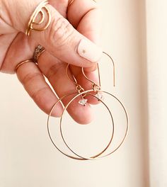 Just as effortless as they are simple, these hoop earrings are an essential everyday piece. Item Details: • This listing is for A PAIR ( 2 pieces ) earrings.• All metal is components are sterling silver and 14k gold-fill• Hoops measure 40mm in diameter.• Herkimer quartz crystals prized, each Herkimer diamond is a natural entity and no stone is identical.• The order will arrive in a gift-wrapped box and free polishing cloth. It will be ready for gift giving. All our work is custom-made by hand in Diamond Hoop Earrings Large, Hummingbird Jewelry, Hummingbird Earrings, Gold Filled Hoops, Minimal Jewelry, Large Hoop Earrings, Quartz Crystals, Diamond Hoop Earrings, Herkimer Diamond