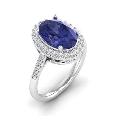 Introducing our exquisite oval blue tanzanite and diamond ring, a true embodiment of elegance and sophistication. Crafted with meticulous attention to detail, this stunning piece showcases a captivating oval-shaped blue tanzanite at its center, radiating a mesmerizing hue that captures the essence of tranquility. Surrounding the tanzanite are dazzling diamonds, meticulously set to enhance its brilliance and create a harmonious contrast. With its timeless design and impeccable craftsmanship, this Elegant Oval Tanzanite Rings, Oval Tanzanite Diamond Ring For Formal Occasions, Oval Tanzanite Blue Diamond Ring, Formal Tanzanite Diamond Ring, Oval Shape, Formal Tanzanite Diamond Ring Oval Shape, Blue Tanzanite Oval Diamond Ring, Oval Tanzanite Diamond Ring With Accent Stones, Formal Oval Tanzanite Diamond Ring, Timeless Oval Tanzanite Rings