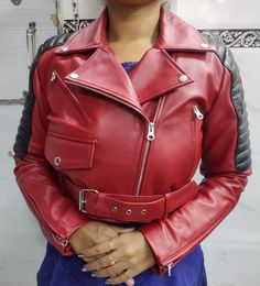 Materials: Sheepskin Leather Color : Red/Black  Closure : Zipper / Ykk Zipper  Front Zip Closure and Belt  Handmade: Yes  Season: Winter, Spring, Fall Occasion: Party, Halloween Style: Cropped Biker  Women's Real Sheepskin Crop Leather BIKER Jacket, Red & Black Combination SHRUG Celebrity Leather Jacket with QUILTED, Christmas Gift for her Handmade, Brilliantly designed, Professionally cut & Premium stitching throughout as per worldwide standards.  Handmade Motorcycle Red  Genuine Leather Jacket | Delicate women's leather jacket |  Motorcycle Black Jacket | Cropped Style Long Sleeves Red | Cropped Moto Bolero Shrug Biker Jacket | Cropped Motor Biker leather Jacket | Natural Soft Leather  Motor Biker Jacket Genuine Handmade Stylish Biker Leather Jacket For Her Slim-fit Long Sleeves, Fashion Red Biker Outerwear With Zipper Closure, Red Fitted Biker Leather Jacket, Edgy Red Biker Jacket For Winter, Red Moto Outerwear With Zipper Closure, Red Long Sleeve Biker Jacket With Zipper Closure, Red Moto Leather Jacket For Motorcycling, Red Long Sleeve Biker Jacket For Winter, Red Moto Outerwear For Winter, Edgy Red Leather Outerwear