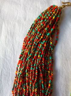 African beaded necklace, multicolored handmade chunky necklace, tribal jewelry. Colour -- yellow with red and mixed colour beads. Length --24 inches. It has a unique not thus makes it more beautiful . Ships via dhl express. Thank you for stopping by. Bohemian Colorful Spacer Beads, Colorful Bohemian Spacer Beads, Artisan Multicolor Multi-strand Beads, Artisan Multi-strand Multicolor Beaded Bracelets, Multicolor Polished Beads For Jewelry Making, Artisan Multicolor Faceted Beads, Colorful Bohemian Faceted Beads, Multicolor Polished Beads Bohemian Bracelets, Multicolor Polished Beads Bohemian Bracelet