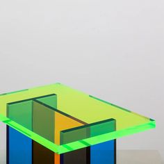 an abstract glass sculpture on top of a table