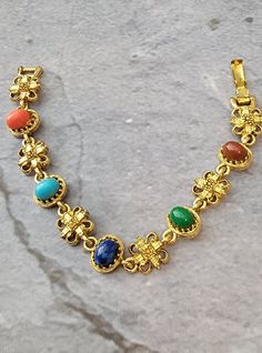 "Lovely vintage ART cabochon bracelet.  Multi colored lucite cabochons on a goldtone bracelet.  Foldover clasp. 7\" length." Cabochon Bracelet, Chain Link Bracelet, Fort Worth, Link Bracelets, Chain Link, Multi Colored, Vintage Art, Fort, Jewelry Bracelets