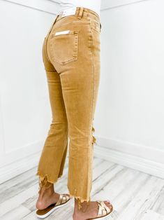 Stay on trend this season with our Vervet High Rise Cropped Flare Jeans in Khaki. Featuring a vintage high rise and cropped flare fit, these jeans are the perfect addition to your wardrobe. The khaki color adds a touch of versatility, making them easy to dress up or down. Pair with your favorite blouse and heels for a night out or keep it casual with sneakers and a cropped tee. Fabric: 94% Cotton, 4% Poly, 2% Spandex SHOP THE LOOK Blue Top - 60853 Necklace - 58349 Trendy Fall Jeans 2022, Jeans For Women Fall 2022, Women Jeans Fall, High Waisted Cropped Flare Jeans, Cropped Flare Jeans Shoes, Jeans For 2022 Fall, 2022 Fall Jeans Trends Women, Shoes With Cropped Jeans, Casual Fall Jeans