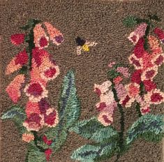 a close up of a rug with flowers on it