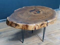 a wooden table with hairpin legs on a hard wood floor