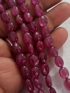 AAA 478 Carat Fine Quality Natural Ruby Smooth Plain 20 Inch Necklace Adjustable code Stone :Natural Ruby Shape :- fancy oval Necklace - 20 inch 2 line string Size :- 5x7mm to 10x12mm Weight :- 478 carat Polish :- Handmade Purity :- 100% Natural Gemstone color - red makes a great gift for your loved ones. It is known as the 'love stone' as the message it emits is the strong vibration of unconditional love, joy, warmth and healing. As quartz crystals are profound amplifiers of energy, it may help Spiritual Oval Gemstone Beads, Oval Hand-strung Beaded Necklaces As Gifts, Oval Hand-strung Beaded Necklace For Gift, Polished Oval Beads Gems And Cabochons For Gift, Oval Natural Stones For Beads, Gems, And Cabochons, Oval Gemstone Beads Necklace Perfect For Gifts, Oval Polished Beads For Gifts, Oval Natural Stone Beads For Gifts, Oval Natural Stones For Jewelry Making