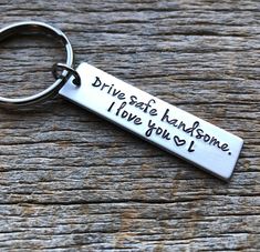 a silver keychain that says drive safe, handsome, i love you son