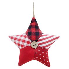 a red and white plaid star ornament with a button on the center, hanging from a string