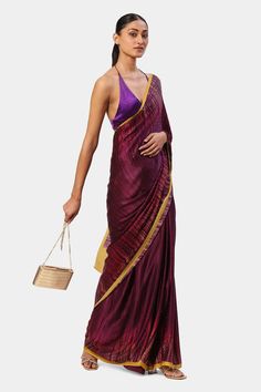 Maroon saree with crystal embroidery and stripe print all over with contrast border.
Components: 1
Pattern: Printed, Embroidery
Type Of Work: Crystal, stripe
Fabric: Georgette Satin
Color: Maroon
Other Details: 
Note: Stitched blouse and bag shown in the image is not for sale
Occasion: Reception - Aza Fashions Maroon Crystal, Satya Paul, Maroon Saree, Printed Embroidery, Crystal Embroidery, Saree For Women, Embroidered Saree, Stripe Fabric, Satin Color