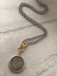 Great bold statement necklaces. Sold separately. Please choose at the drop down menu. 1. Mix metal medallion coin long necklace features an antique silver coin set in a bell bezel frame with rope edges. It measures 38mm in diameter excluding the bail. It hangs on a mariner clasp a puffy CZ clasp closure. This pendant is removable. All components are gold plated. Belcher rolo chain is 6mm wide and is stainless steel. It is anti tarnish and Nickel/lead free. This necklace is approximately 32 inche Bold Statement Necklaces, Clover Charm, Jewelry Safe, Coin Set, Statement Necklaces, Rolo Chain, Coin Necklace, Mixed Metals, Silver Coins