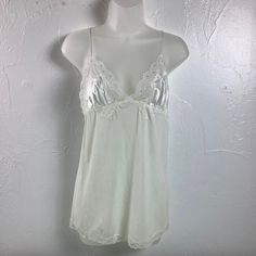 Vintage Old Stock 11 03 New With Tag Victoria’s Secret Size Medium From A Smoke Free Home Bridal Nighty Babydoll Slip Dress Detailed Beautifully Adjustable Strap Ivory Color Shear Lace Detail Lace Trim Pit To Pit 15 Elastic To 18.5 Length Pit To Hem 16 Plz Don’t Hesitate To Ask Questions Thank You White Summer Cami Nightgown, White Lace Trim Nightgown For Spring, White Sleeveless Sleepwear With Delicate Lace, Vintage White Night Dress, White V-neck Nightgown With Delicate Lace, White Camisole Nightgown For Spring, White Lace Chemise For Bedtime, White Lace Trim Chemise For Loungewear, White Lace Camisole Chemise