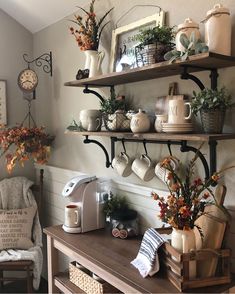 a coffee bar with shelves filled with mugs and other items on top of it