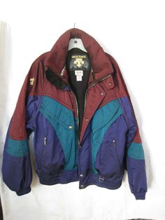 VINTAGE DESCENTE SKI JACKET-PRE-OWNED GREAT CONDITION Double frontal zipper closure with snap button Elastic waist and cuffs One inside zippered pocket and one open pocket ARMPIT ZIPPERED VENTS Two exterior zippered pockets Hidden hood 80s Winter Jacket, 80s Jacket Men, Hooded Sport Coat For Fall Winter Sports, Hooded Outerwear For Ski Season, Hooded Winter Outerwear For Snowboarding, Winter Hooded Snowboarding Outerwear, Winter Snowboarding Hooded Outerwear, Hooded Long Sleeve Jacket For Skiing, Winter Skiing Hooded Jacket With Long Sleeves