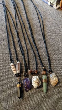 Listing is for one black cord necklace with a slip fastener, wooden beads, and one gemstone wrapped in copper wire. Choices are: Obsidian (black) Howlite (white) Adventurine (green) Amethyst (purple) Moonstone (translucent) Handmade Adjustable Crystal Necklaces With Copper Wire, Handmade Adjustable Crystal Necklace With Copper Wire, Handmade Adjustable Copper Wire Crystal Necklace, Handmade Adjustable Copper Wire Crystal Necklaces, Bohemian Black Necklaces With Copper Wire, Unique Hand Wrapped Necklace With Waxed Cord, Adjustable Copper Wire Crystal Necklaces For Healing, Gift Wire Wrapped Necklace With Waxed Cord, Black Cord Necklace