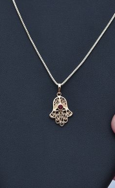 Hamsa Necklace Lucky Hamsa Necklace Gold Hamsa Necklace Inlaid Red Gemstone Fine Ruby Stone Necklace Fatima Hand Chain Spiritual Necklace Filigree Work Filigree Jewelry Gold Fatima Hand Jewelry Hamsa Jewelry Ruby stone jewelry Hamsa necklace made of high quality 21K gold filled A gift for a woman A gift for Valentine's Day A gift for an anniversary A gift for her A gift for a mother Red Gemstone Pendant Necklaces, Spiritual Red Round Pendant Jewelry, Red Gemstone Pendant Necklace, Red Spiritual Round Pendant Jewelry, Traditional Red Necklace With Round Pendant, Handmade Ruby Necklace For Gift, Red Birthstone Necklace For Weddings, Red Filigree Pendant Jewelry, Traditional Red Round Pendant Necklace