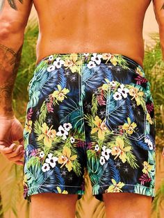 Get ready to embrace the tropical paradise with our Flower Tropical Print Swim Trunks. These swim trunks feature a vibrant and captivating floral print that instantly transports you to a beach getaway. The drawstring waist ensures a comfortable and adjustable fit, allowing you to enjoy your time in the water with ease. Specifications: Pattern Type: Tropical, All Over Print Details: Drawstring, Pocket Type: Bottoms Bottom Type: Shorts Fabric: Non-Stretch Composition: 100% Polyester Care Instructi Multicolor Hawaiian Summer Bottoms, Multicolor Hawaiian Shorts For Beach Season, Spring Beach Black Swim Trunks, Tropical Short Swim Trunks For Summer, Tropical Short Swim Trunks For Beach Season, Tropical Style Short Swim Trunks For Beach Season, Multicolor Hawaiian Bottoms For Vacation, Hawaiian Short Swimwear For Beach Season, Hawaiian Style Swim Shorts