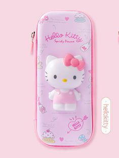 a pink hello kitty pencil case sitting on top of a pink table next to an eraser