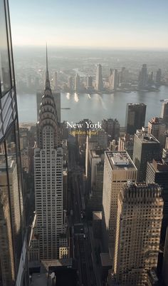 an aerial view of new york city with the empire building in the foreground and other tall buildings