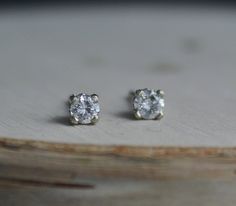 Stunning 14k white gold diamond stud earrings. Each round diamond is .10ct for a .20 TCW. The diamonds are H-I color and SI2 clarity. These earrings come with 14k white gold friction backs. The settings are a decorative stud mounting, sweet and feminine. Each diamond is 3mm in diameter. Perfect set of studs to pair with other earrings or wear on their own. Ready to Ship! White Round Diamond Earrings, Minimalist White Gold Diamond Earrings With Single Diamond, Everyday Diamond White Earrings With Diamond Cut, Everyday White Diamond Earrings With Single Diamond, Everyday White Gold Diamond Earrings With Single Diamond, Everyday White Single Diamond Earrings, Minimalist White Diamond Earrings With Single Stone, Minimalist White Diamond Earrings With Single Diamond, Minimalist Diamond Earrings With Single Diamond