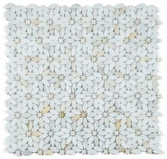 a white tile with small flowers on it