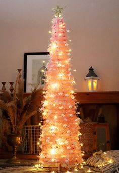 a white christmas tree with lights on it