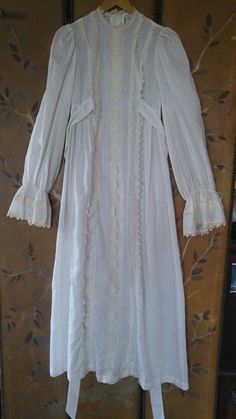 "70's so gorgeous boho wedding / hippie / maxi prairie dress. Semi sheer light ivory with tiny tan polka dots fabric. Crochet cream flower lace detail down the front, around neck and at ends of flared cuffs. End of sleeves are elasticated just above the wide cuffs. Two long ties at sides of bust and buttons up the back. **Back of neck lace trim has some bleaching on the cream crochet and tiny bleach spot at bottom of trim on front but barely visible.** Such a unique and gorgeous dress! Made by C Crochet Flower Lace, Fabric Crochet, Tiny Tan, Cream Flower, Light Ivory, Polka Dot Fabric, Le Crochet, Flower Lace, Prairie Dress