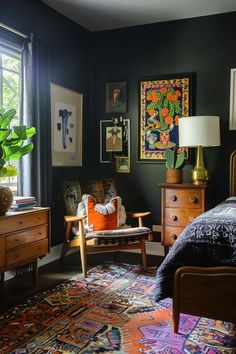 a bedroom with black walls and colorful rugs