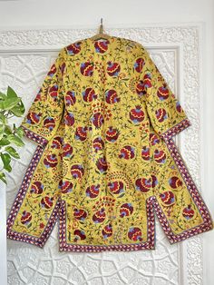 Uzbek hand embroidery suzani robe, chapan, coat. * Measurements: length - 125 cm, chest round - 120 cm, hips round - 120 cm, sleeve - 48 cm, sleeves round - 44 cm * Coat with ikat inside lining "Suzani" means needlework, but to most collectors, the word has a more specific meaning: "suzani" is synonymous with the glorious embroideries of Uzbekistan, in Central Asia. In recent years, we've witnessed a remarkable revival of this old traditional art form. These textiles are pretty complex, which indicates their importance. In fact, suzanis were part of a bride's dowry, generally started at the birth of a daughter and continued with the help of family and friends until the bride's dowry was complete and ready to be presented to the groom at the wedding. It was a symbol of the family's status, Traditional Long Kurta With Printed Motifs, Traditional Long Kurta With Block Print, Traditional Yellow Cotton Kimono, Traditional Long Sleeve Block Print Kimono, Traditional Multicolor Kurta With Kimono Sleeves, Traditional Long Kimono With Floral Print, Traditional Long Floral Print Kimono, Yellow Bohemian Long Sleeve Kurta, Yellow Long Sleeve Bohemian Kurta