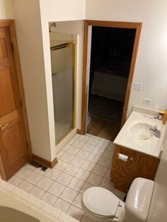 Ideas to modernize a home or room with dark wood trim. Shown here is a 1980s bathroom with an 8x8 tile floor, oak vanity, and almond fixtures. 

#updateideas #homeupdate #woodtrim #woodcabinets #kylime 1980s Bathroom, Oak Vanity