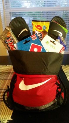 the back pack is filled with sports items