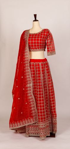 Beautiful red, organza silk lehenga with silver glitter zari embroidery work. The blouse is slip on (no side zipper or hooks) with quarter sleeves. There is one inch seam available on both sides of the blouse to make bigger if needed. There is bra padding and waist string included in the lehenga. Measurement: Chest = 17 inches (1 inch additional available on both left/right sides of blouse to expand to make larger if needed) Waist = 16.5 inches Length = 13.5 inches Red Tissue Silk Lehenga With Dori Work, Red Tissue Silk Sets With Dori Work, Red Tissue Silk Dupatta With Dori Work, Red Organza Blouse Piece With Traditional Drape, Red Organza Sharara For Eid, Fitted Red Organza Blouse Piece, Red Fitted Organza Blouse Piece, Red Tissue Silk Lehenga For Festive Occasions, Red Organza Anarkali Set For Festive Occasions