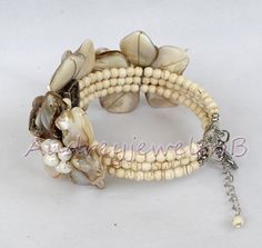 "Applications: wedding, engagement, daily wear,party Material: Pearl, shell,Turquoise beads beads size :4-6-8mm,15*15mm Bracelet Size:6.5-7\"+2\"Extend the chain Color: As show We can adjust the length of your requirements All the product are designed and made by myself so if you want any adjustments in length or style, don't forget to contact me. Otherwise, I will send you the one in the picture. Welcome wholesale and customization. We can customize according to your requirements. Payment We ac Mother Of Pearl Bangle Jewelry Gift, Mother Of Pearl Bangle For Gift, Adjustable Mother Of Pearl Bracelets For Weddings, Adjustable Mother Of Pearl Wedding Bracelets, White Shell Jewelry Gift, Mother Of Pearl Beaded Bracelet As A Gift, Bohemian Adjustable Pearl Bracelet For Wedding, Adjustable Beaded Shell As Gift, Adjustable Pearl White Flower-shaped Jewelry