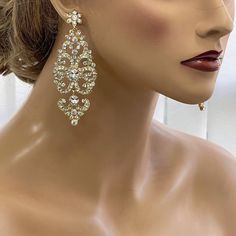 a mannequin head with earrings on it