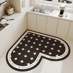 a black and white kitchen rug with stars on it