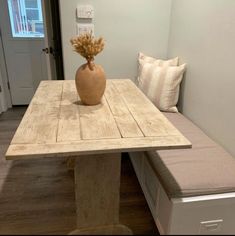 a wooden table with a bench underneath it