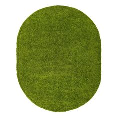 an oval shaped green grass rug on a white background with room for text or image