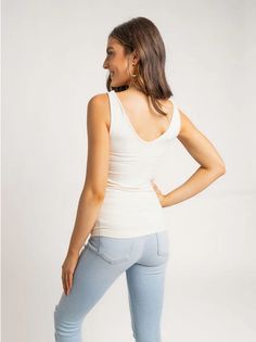 Meet our our new tank top obsession. This Seamless Tank features a v-neckline and a scoop neckline, so you can style it 2 ways. Style it with the v-neck in front and the scoop neck on back, or the other way around! The material makes this top buttery soft and super stretchy. - Can be worn with a v-neck or scoop neck - Stretchy Material 92% nylon 8% spandex Hand wash cold, lay flat to dry. New Tank, 2 Way, Stretchy Material, Sales Gifts, Scoop Neckline, Chestnut, Basic Tank Top, Scoop Neck, White And Black